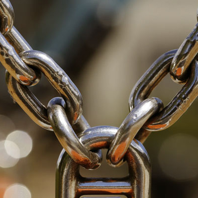 Why does a stainless steel chain experience periodic chain drop?